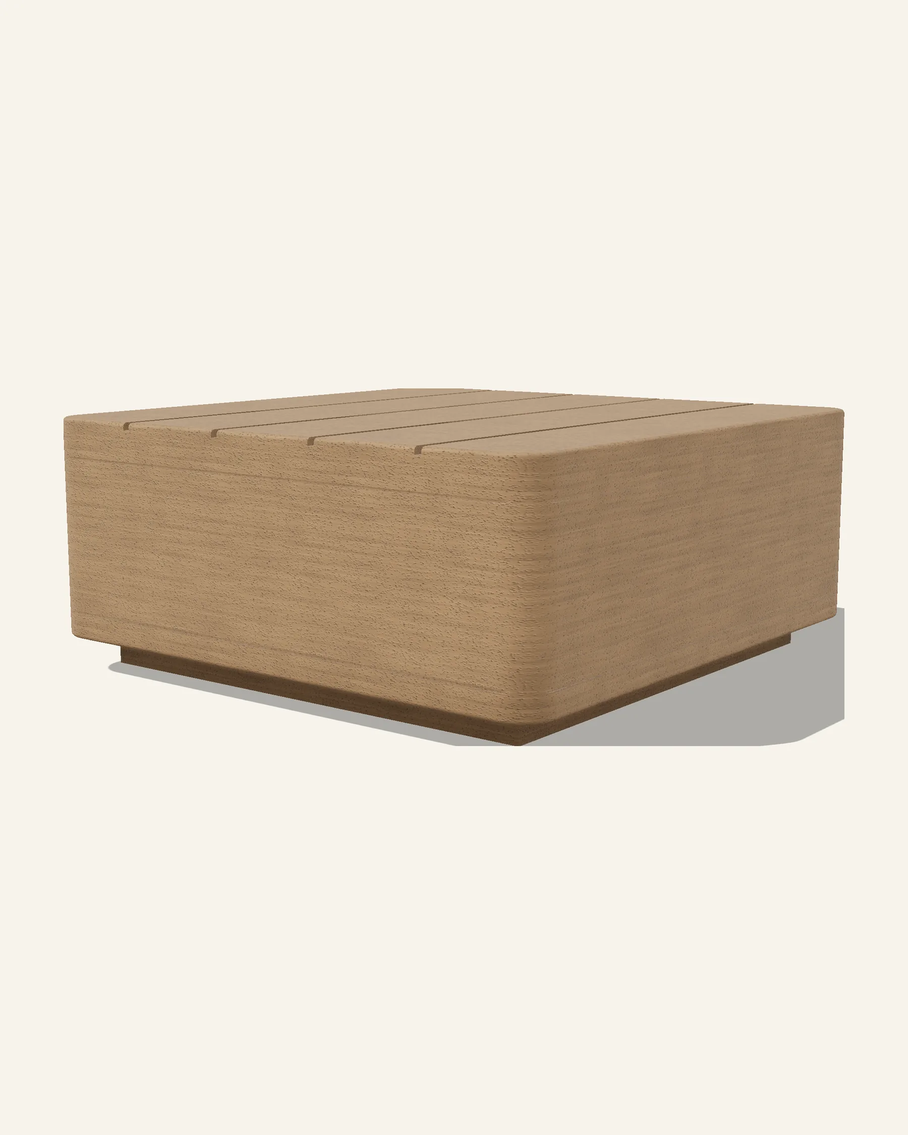 The Rima low table alone on a plain warm ground: a solid timber block with generously rounded vertical corners and a planked top, on the same recessed plinth.