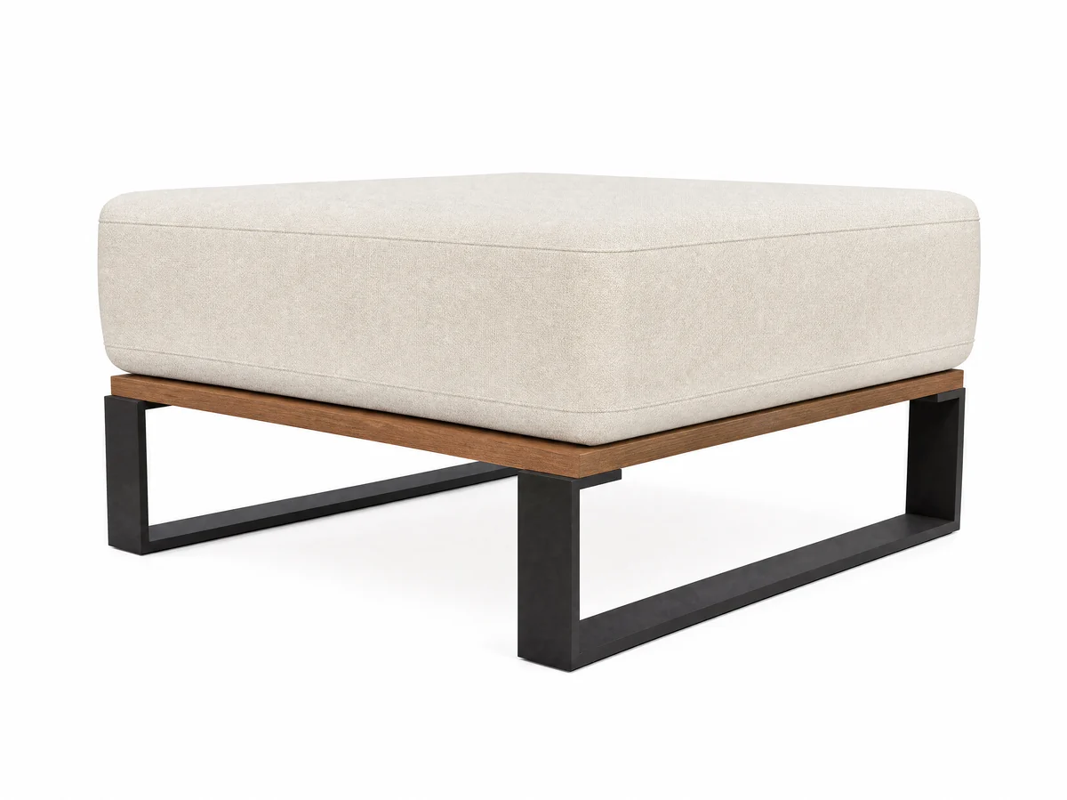 The Nour pouf, photographed on white: an 800 millimetre square seat with no back at all, on a matte black frame over an oiled teak rail.